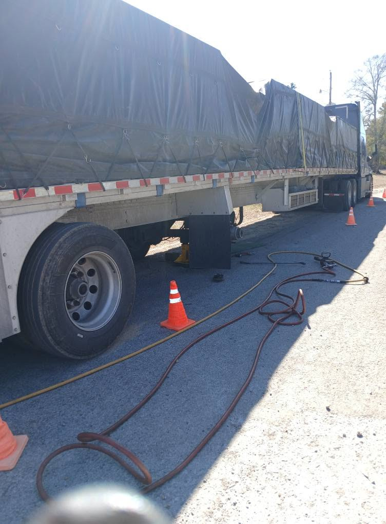 Jesse's Tires roadside service on a semi truck trailer